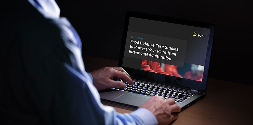 Worker in front of laptop sitting at a table